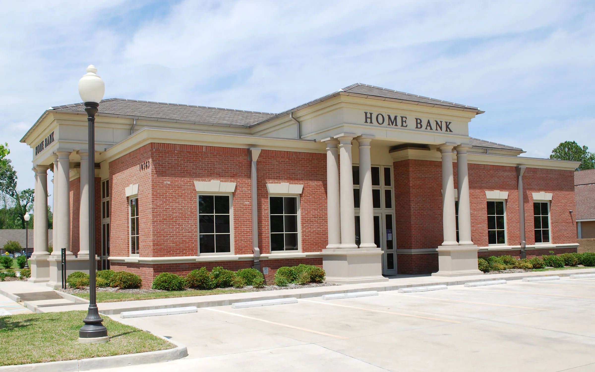 Classical red-brick Home Bank branch with columns.